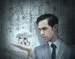Concentrated businessman holding a cloud