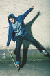 Skater doing truck stand on his board