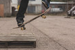 Skater doing ollie off wooden crate