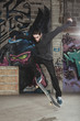 Skater doing impressive backside half cab 180 trick