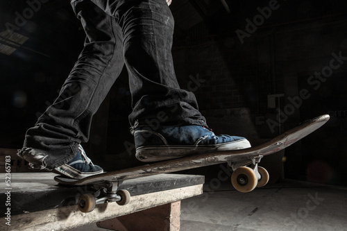 Photo: Skater balancing on edge on manual pad Skater balancing on edge on manual pad