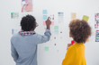Designers pointing at a photo