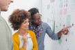 Team of designers pointing at a photo