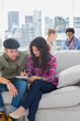 Pair of workers working together on a couch
