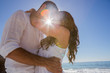 Romantic couple cuddling on the beach