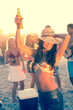 Woman holding beer during a party