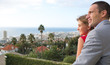 Couple looking at the view from their balcony