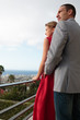 Delighted couple standing on the balcony