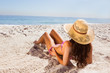 Brunette tanning on the beach