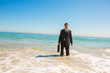 Handsome businessman standing in the sea