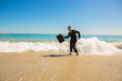 Businessman gesturing on the beach