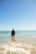 Businessman standing in the sea