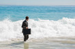 Businessman looking at the sea