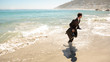 Businessman running out the sea