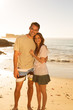 Couple standing and embracing on the beach