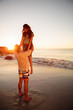 Man lifting up his girlfriend on the beach