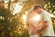 Attractive couple embracing in a park