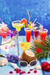 colorful mixed cocktails in tropical blue wood