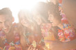 Cheerful friends holding cocktail glasses
