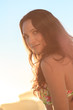 Young pretty woman posing on the beach