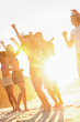 Friends dancing on the beach 