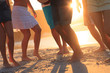 Group of people dancing on the beach