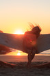 Woman in hammock on the beach