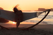 Woman in hammock on the beach shaking her hair
