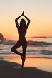Sunset with woman doing yoga