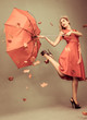 Attractive glamour woman holding a broken umbrella