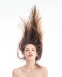 Pretty young woman topless with hair floating