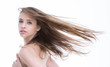 Pretty young woman topless with wind in the air
