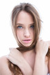 Sexy topless woman roping her hair around her neck