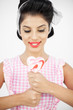 Sexy young pinup holding a lollipop