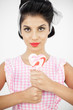 Young pinup holding a lollipop