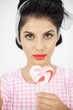 Glamorous pinup holding a lollipop