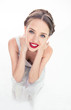 Cheerful fresh teen with red lipstick crouched