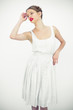 Pretty teen posing with a white dress