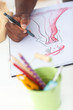 Artistic man drawing clothes