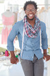 Fashion designer standing with a measuring tape around his neck