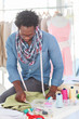 Fashion designer working on a green textile