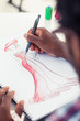 Artistic man drawing clothes with a pencil