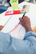 Artistic man drawing clothes in a studio