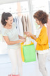 Two attractive friends looking at their purchase