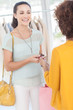 Woman purchasing clothes with her credit card