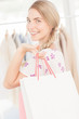 Attractive blonde woman holding a shopping bag