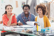 Happy fashion designers working together