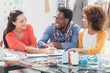 Cheerful fashion designers working together