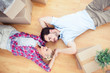 Young lovers relaxing on the wooden floor