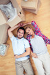 Young lovers resting on the wooden floor